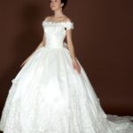 cheap wedding dress with neckline off the shoulders balloon skirt floral decorations.