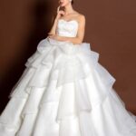 Special wedding dresses with full skirt full of flounces and light lace bodice with sweetheart neckline.