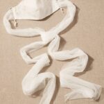 Satin mask for the bride combined with the dress with bright decorations