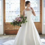 A-line wedding dress with a straight neckline made in satin