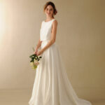 Simple satin A-line wedding dress with soft skirt and scoop neckline