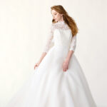 Princess wedding dress made of organza and lace with a high neck