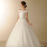 Princess wedding dress online with lace bateau neckline.