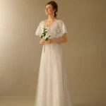 Inexpensive empire style wedding dress with V-neckline made of organza and lace