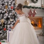 Baby girl first communion dresses cheap prices on the internet made in satin and lace with transparent short sleeves