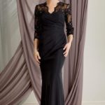 Very elegant grandmother of the bride formal dress made in draped taffeta with V-neck and three quarter sleeves jackek in tulle and lace