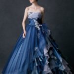 Dark blue and white princess-style wedding dress made of organza enriched with lace and sequins applications
