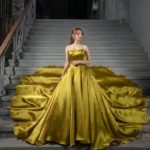 Yellow princess-style satin wedding dress with semi-rigid and preformed bodice and sweetheart neckline