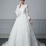 Wedding dress on sale at an affordable price with sweetheart neckline and bustier shrug, lace embroidered top that tucks over the bustier