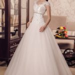 Messina wedding dresses, A-line wedding dress with draped bodice decorated with lace appliqués