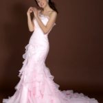 Pink mermaid wedding dress made of organza and satin with lace appliqués for sale at an affordable price
