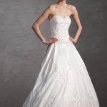 A line style 2021 collection wedding dress in satin with semi-rigid sweetheart neckline embellished with embroidery, beads, rhinestones and sequins