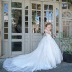 Princess-style wedding dress with a narrow bodice finely embellished with a sweetheart neckline and a wide, fluffy skirt in soft tulle