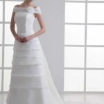 Classic A line style tailored wedding dress made in organza with drooping straps