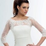 Bridal bustier jacket made of transparent tulle with lace embroidery on the edges