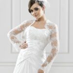 Wedding jacket with long flared sleeves made of semitransparent tulle with lace and pearl embroidery