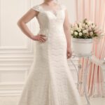 Plus size mermaid style wedding dress in lace and tulle with satin lining, with short sleeves from the 2021 collection