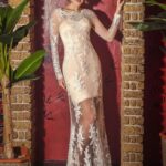 Long sheer wedding dress with lace long sleeves and satin inner mini skirt, perfect for beach wedding