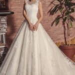 Wedding dress with chapel train made in tulle with many lace appliques, wide skirt, very traditional dress.