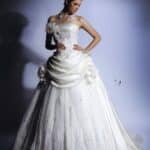 Very special wedding dress made of taffeta and lace with a straight neckline A line