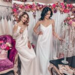 Fresh satin wedding dress for a summer look, with a straight cut, spaghetti straps and a beautiful V-neck