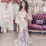 Semitransparent wedding dress in tulle and lace decorated with small pearls and sequins that create a seductive combination