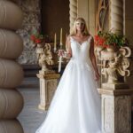 Enchanting and sophisticated are the right adjectives to describe this plus size wedding dress